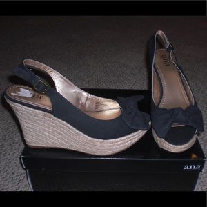 Size 10 wedge sandals. Black bow tie. Gently used.